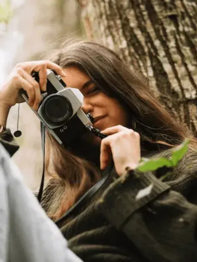 cropped-young-woman-taking-photo-nature_23-2148192732-1